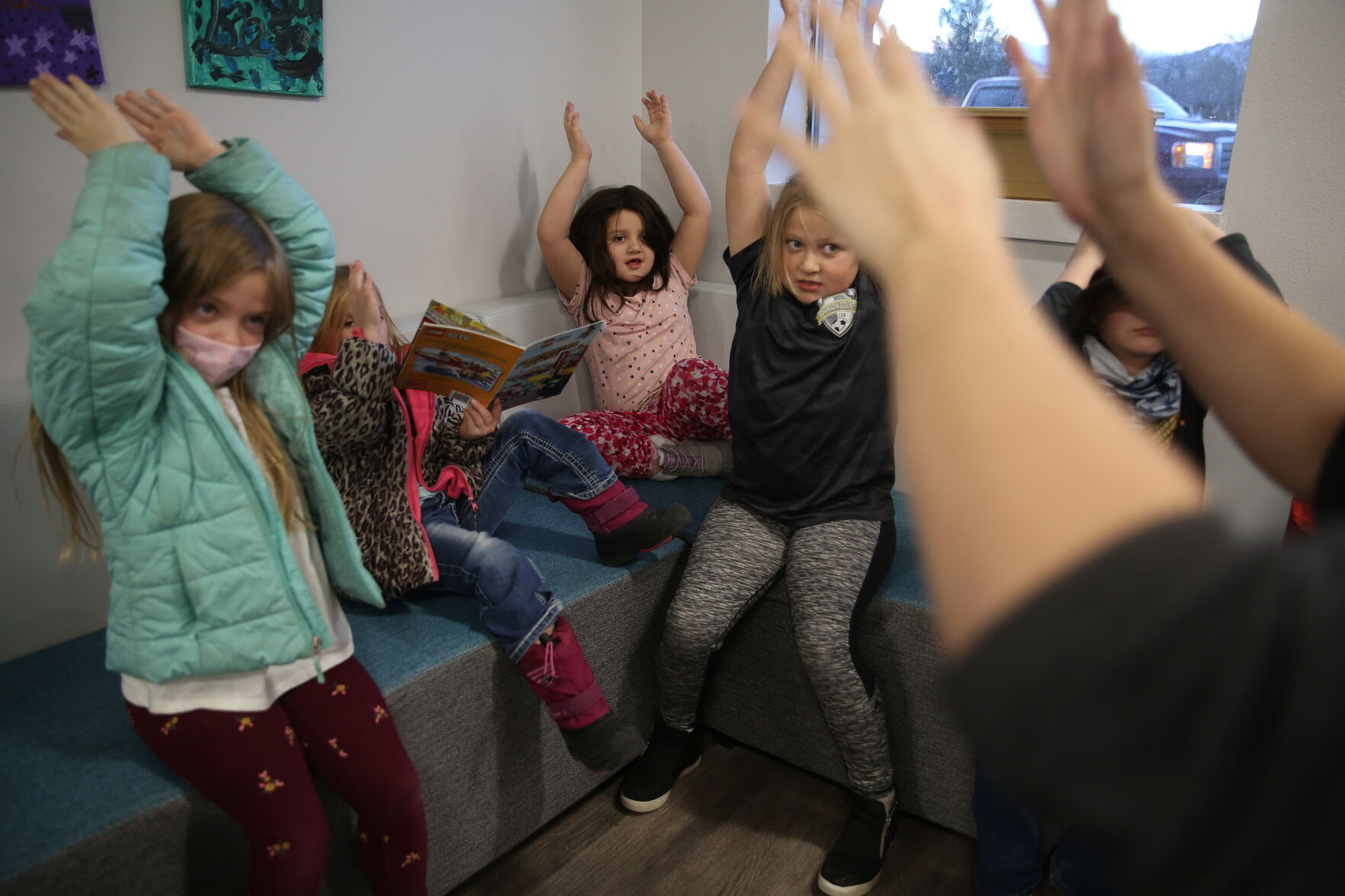 The photography kids throw their hands in the air